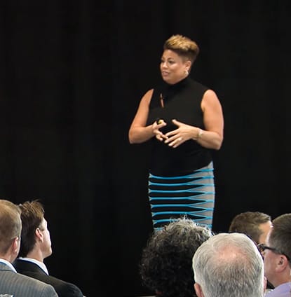 Adrienne keynote speaking at conference